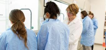 Assistant Professor Grace Ferris and Lesley students in the lab