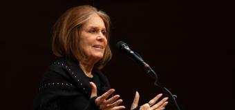 Gloria Steinem speaks at the Symphony Hall podium