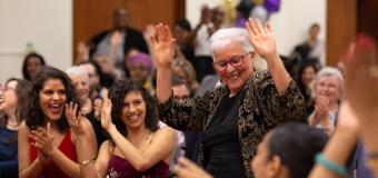 Students cheer on Dalia Llera as she dances through the crowd