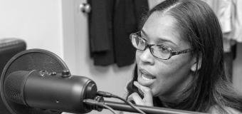 Black and white photo of Fabiola Decius speaking into a microphone.