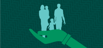 a hand outstretched, holding a silhouette family