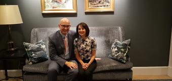 Chris Gaffney and Karen Kames sit together on a couch.