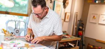 Artist Keith MacLelland working in his studio