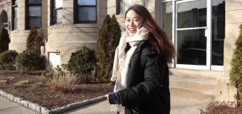 Yuka Chen standing outside with a building behind her.