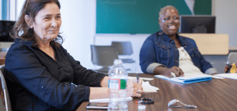 women sitting at a conference table