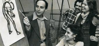 students listen and laugh with drawing instructor in studio circa 1978