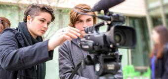 students filming on location