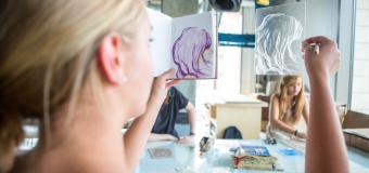 student judging two works of art