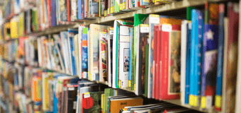 Colorful childrens books on a shelf