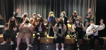 Photo of cabaret cast posed on the Washburn Auditorium stage