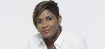 Portrait of Celeste Mohammad sitting, wearing a white shirt.