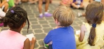 Children sitting in a circle on the floor