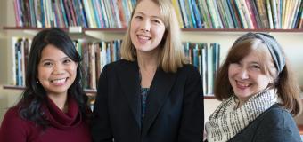 Classroom Bookshelf authors Grace Enriquez, Erika Thulin Dawes, and Mary Ann Cappiello, in front of bookshelf