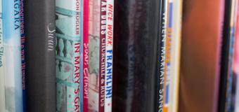 Classroom bookshelf filled with books about social justice