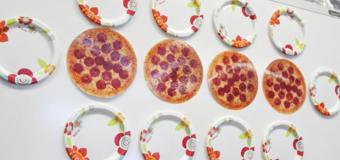 Pictures of pizzas and plates on a whiteboard.