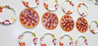 Pictures of pizzas and plates on a whiteboard.
