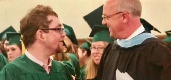 Daniel Dubinsky and Jim Wilbur in academic regalia at Threshold graduation