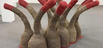 plastic bag sculpture crocheted by Michelle Lougee shows a brown and red tentacled form