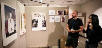two mfa students discuss each other's work during residency 