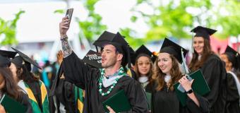 graduates pose for a selfie