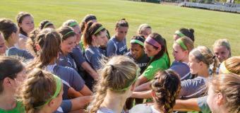 women's soccer team huddle