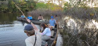 students on a river in Guyana