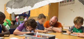 students doing arts and crafts with a teacher