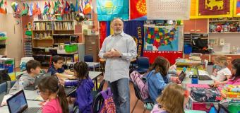 Teacher Wayne Jensen and students in his colorful classroom