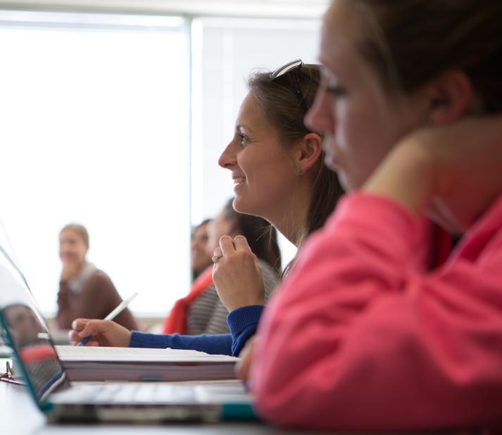 student with a computer