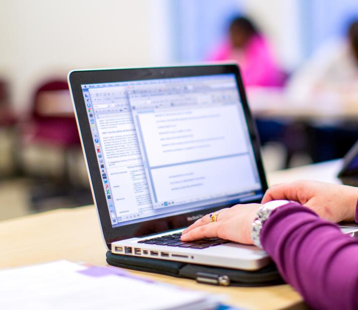 student working on a laptop