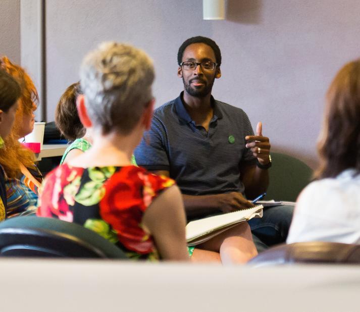 Counseling and Psychology PhD Alum in a Classroom with Peers