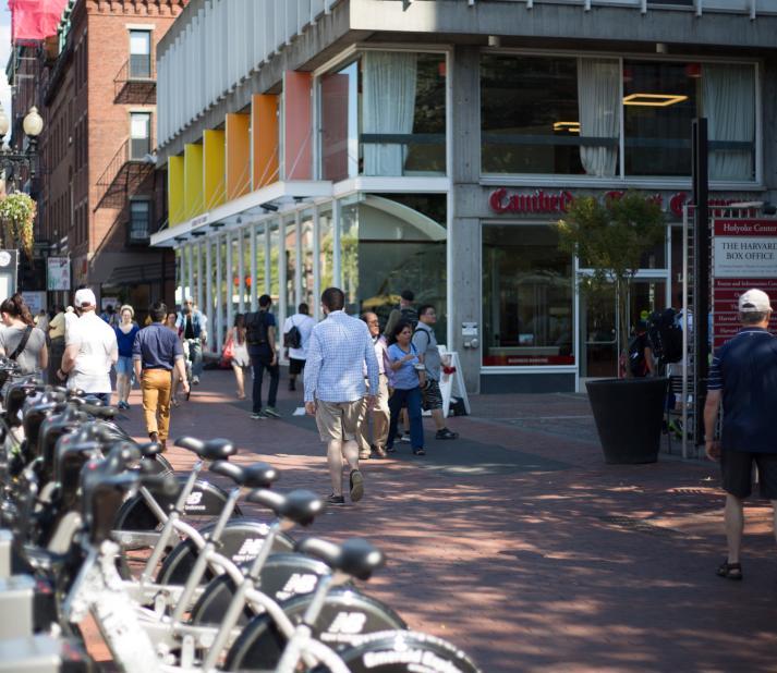 man walking in harvard square, cambridge