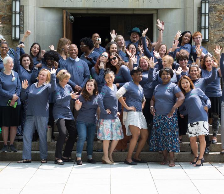 Group shot of alumni admissions ambassadors standing on the steps of St. John's Hall on rattle Campus