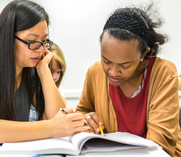 2 female students studying in classroom at Bunker Hill Community College