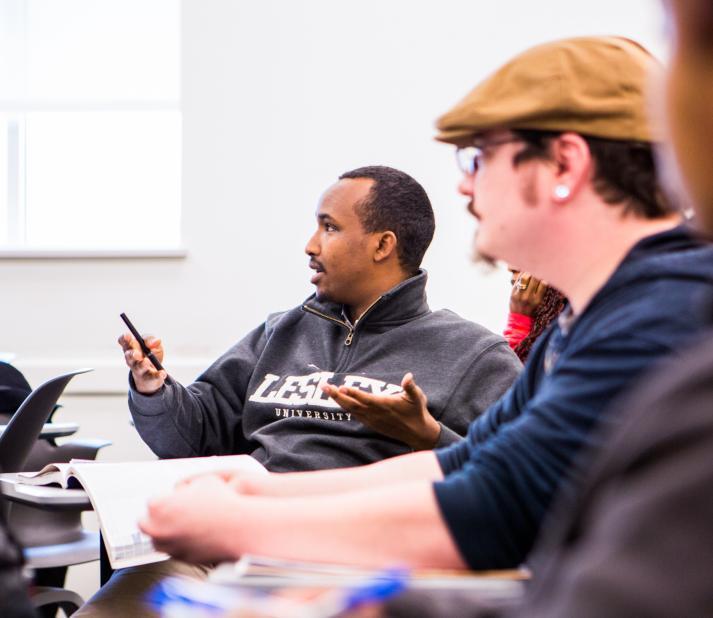 3 students sitting in classroom at Bunker Hill Community College
