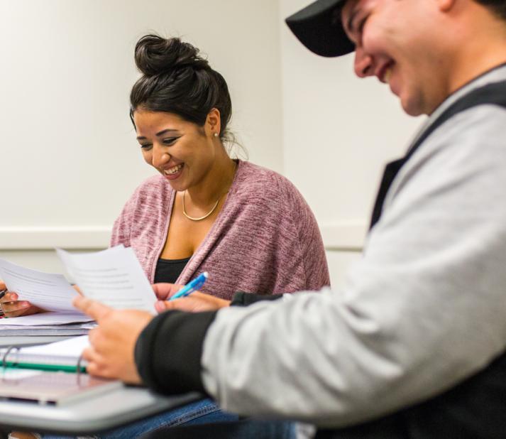 3 students sitting at classroom at Bunker Hill Community College
