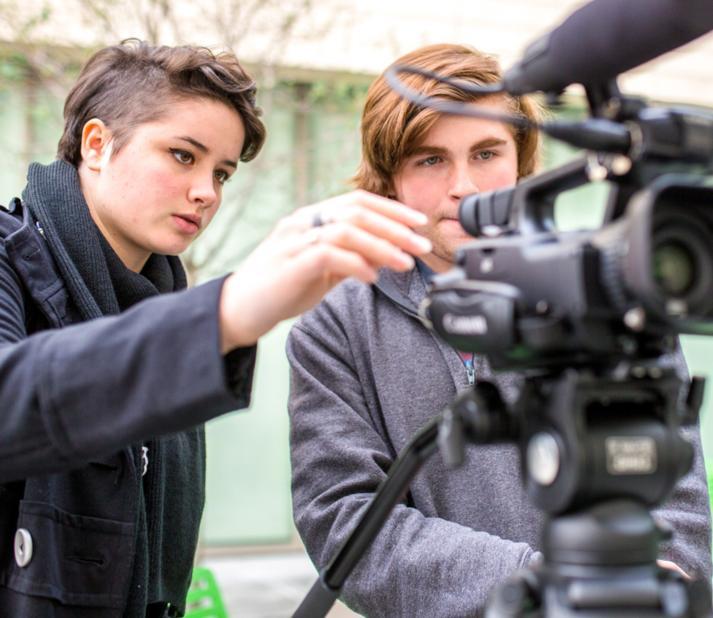 students filming on location