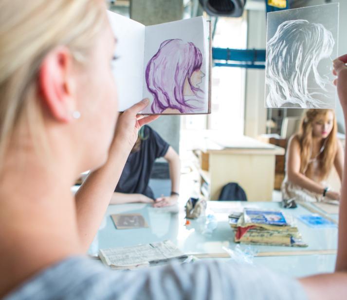 student judging two works of art