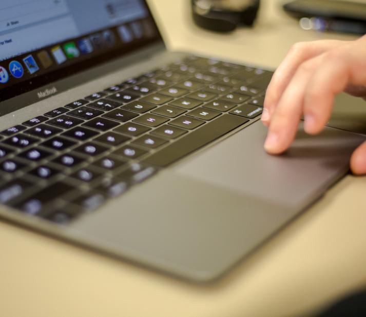 hand on laptop computer