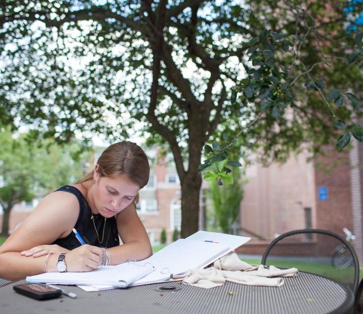 female writing outside