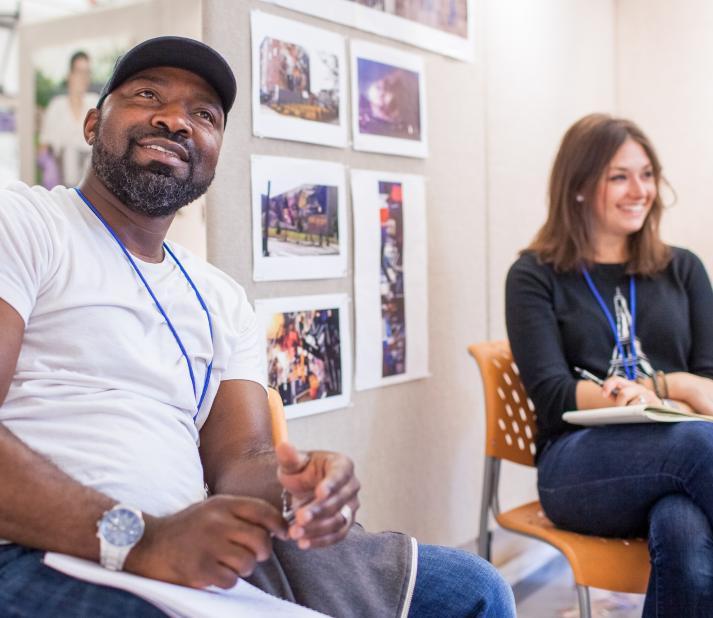 two students engaging in an art portfolio critique