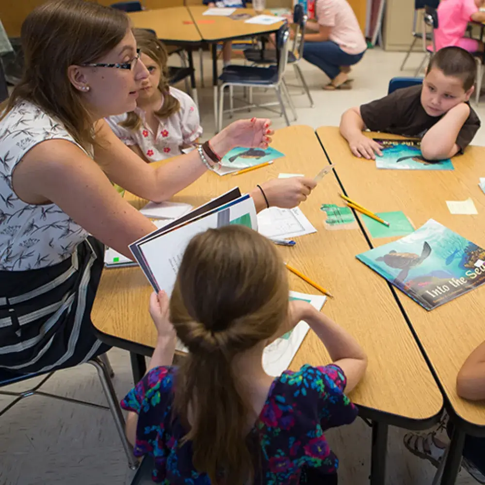 Teacher and Students reading books