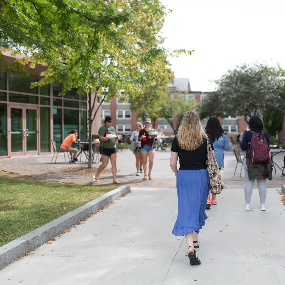 woman walking on campus