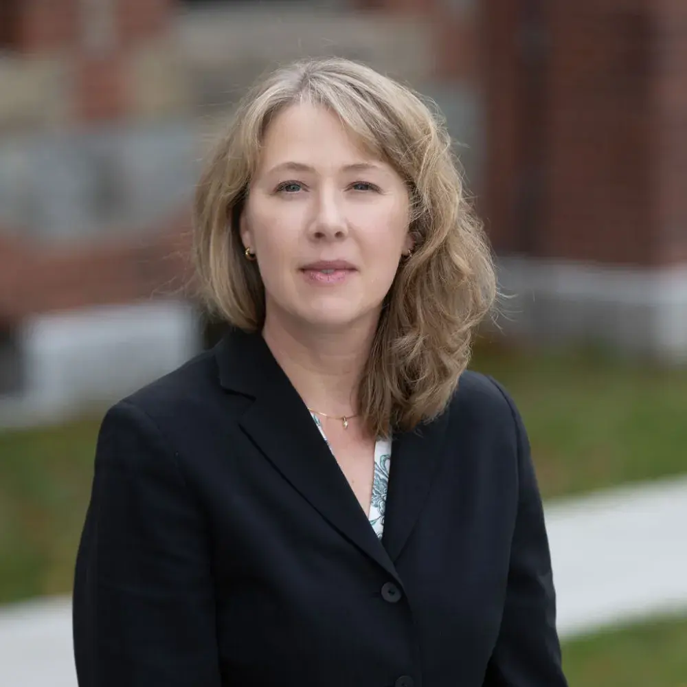 Headshot of Erika in black blazer