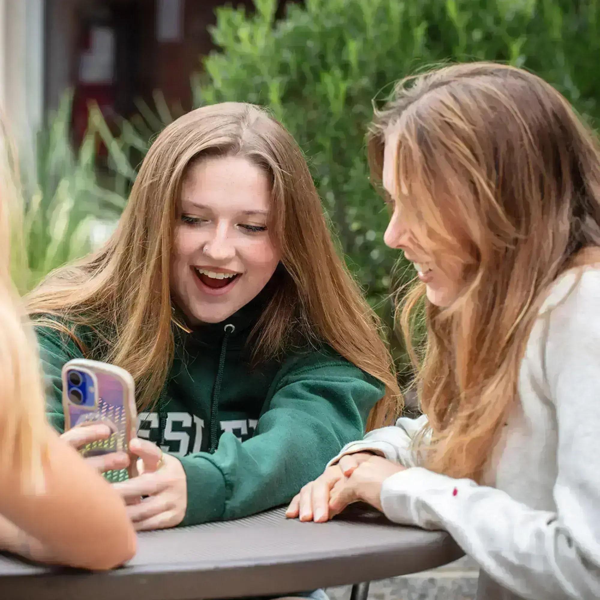 students looking at phone