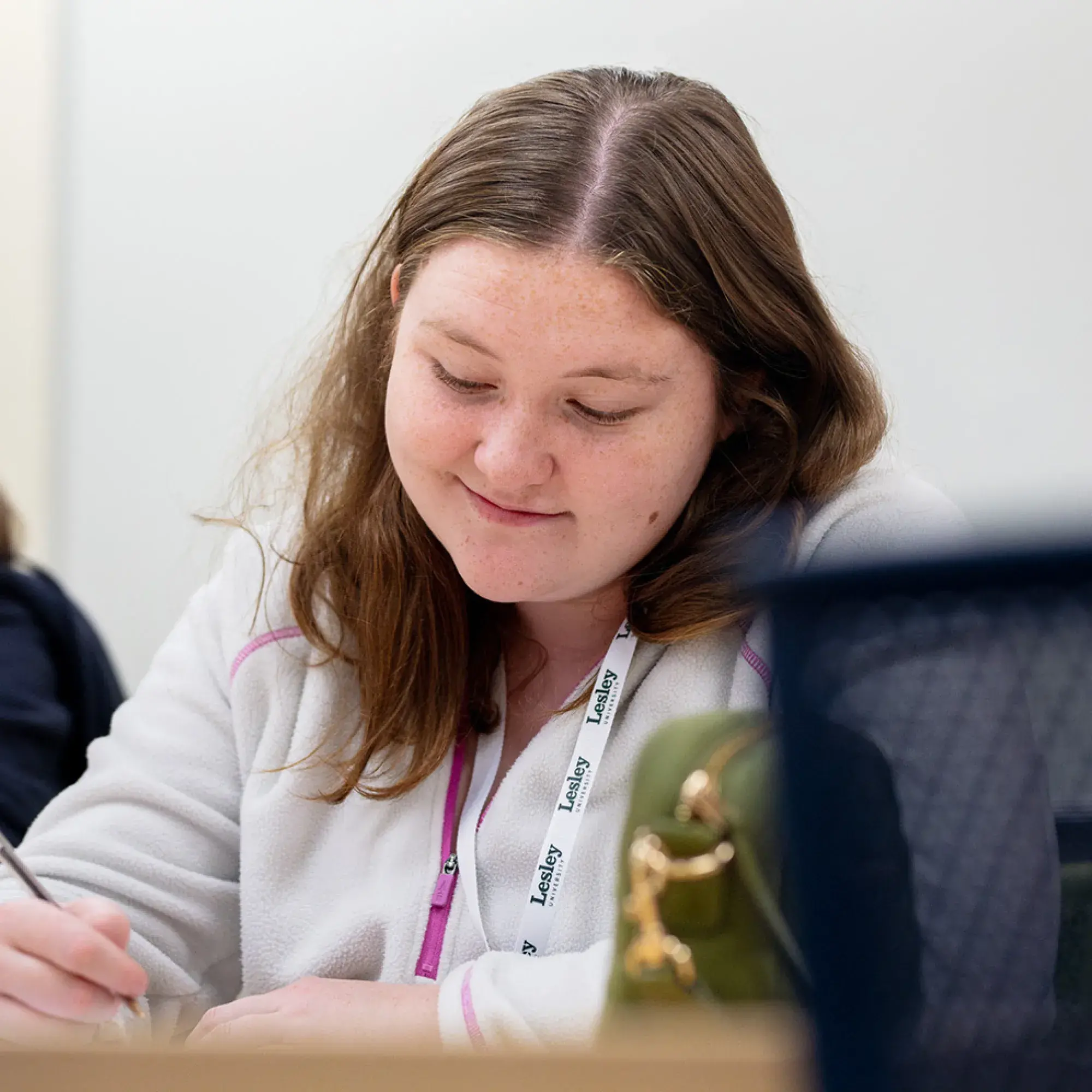 student taking notes