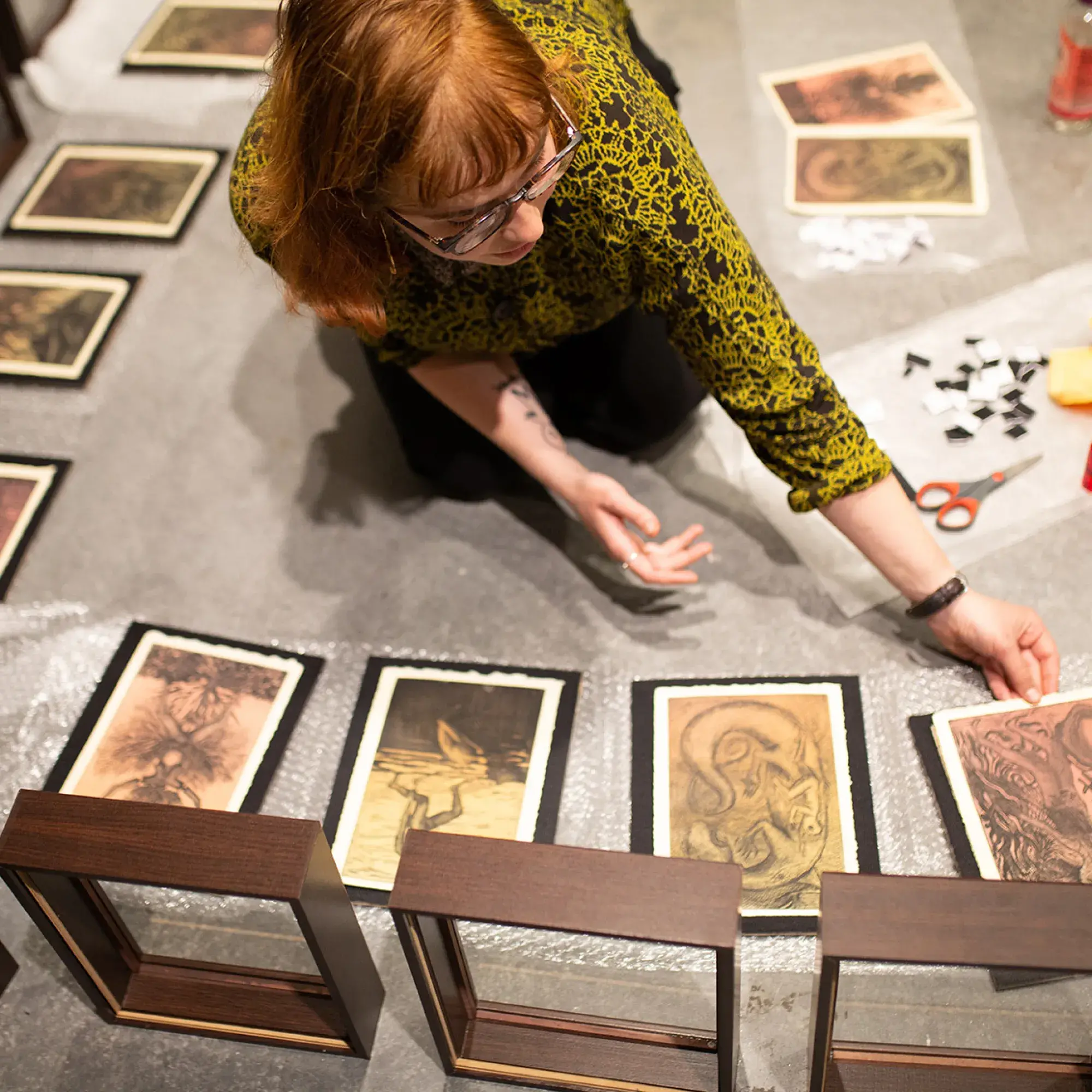 student placing illustrations in frames