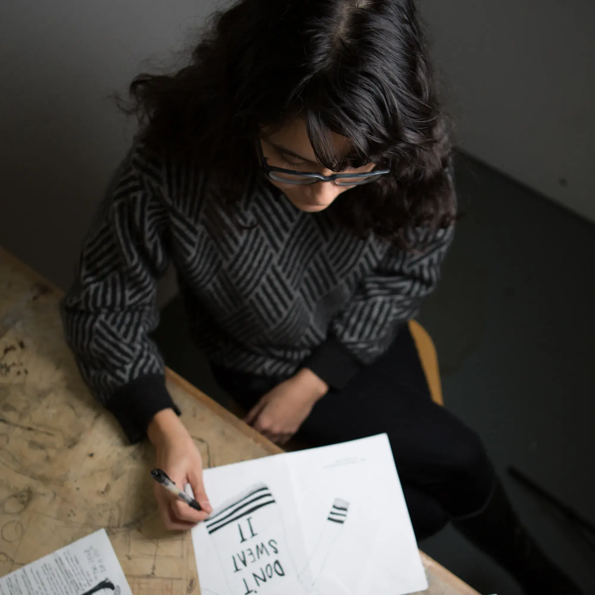 student designing cards