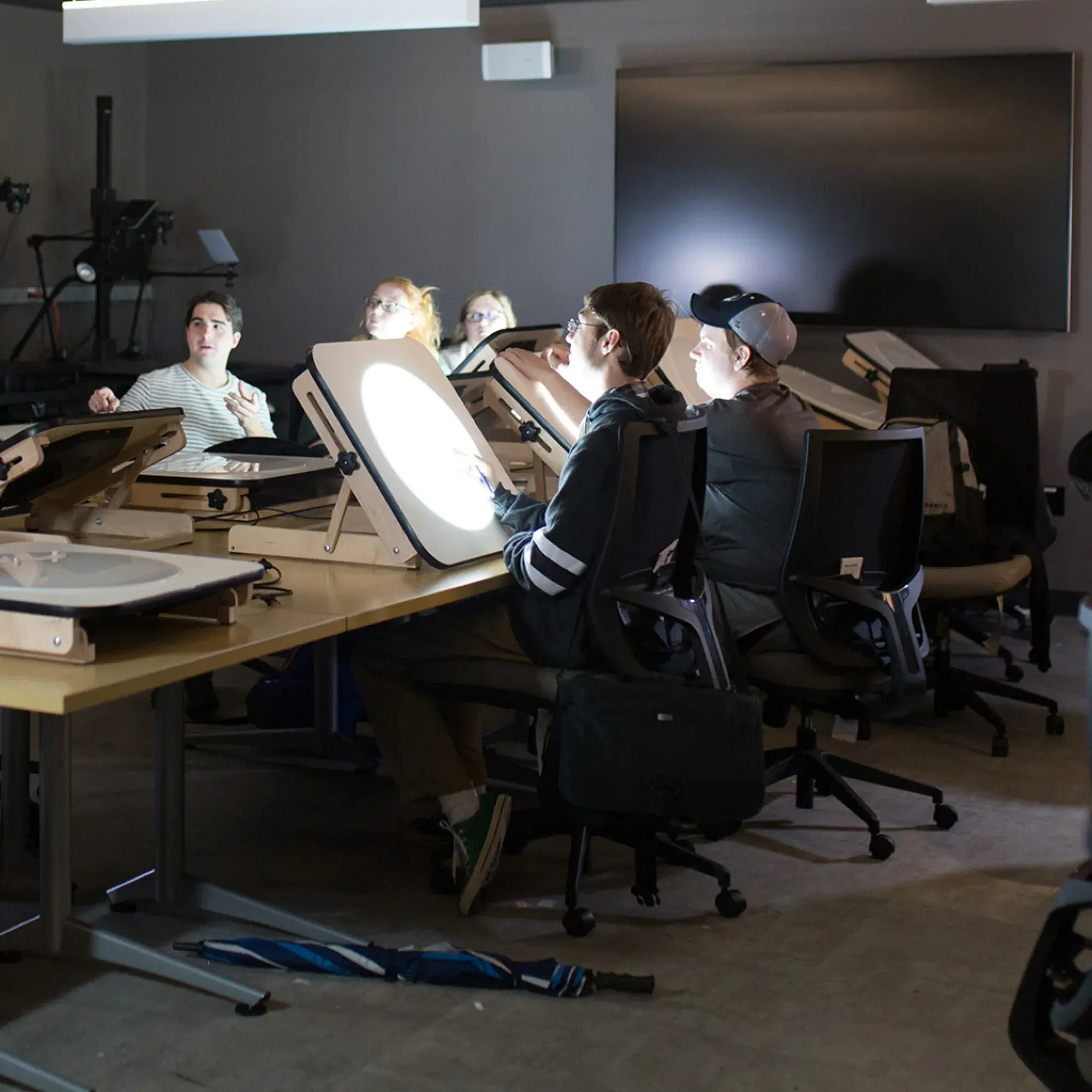 students and faculty in animation studio