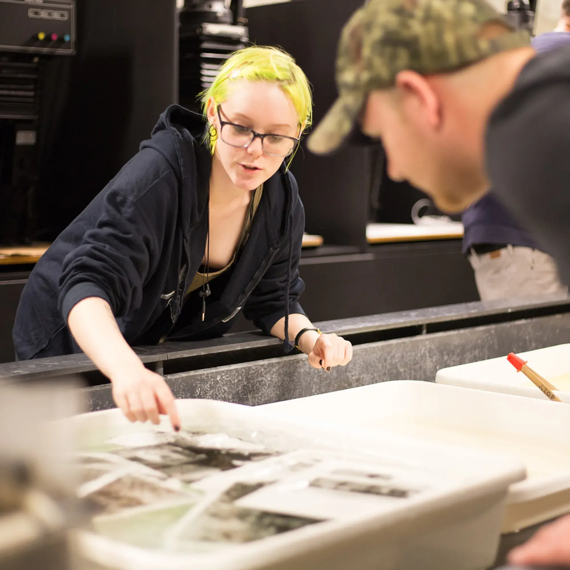 students looking at photography